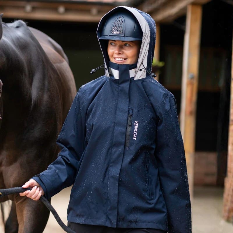 Reincoat Air jacket worn at the yard - fitted waterproof shell for riders